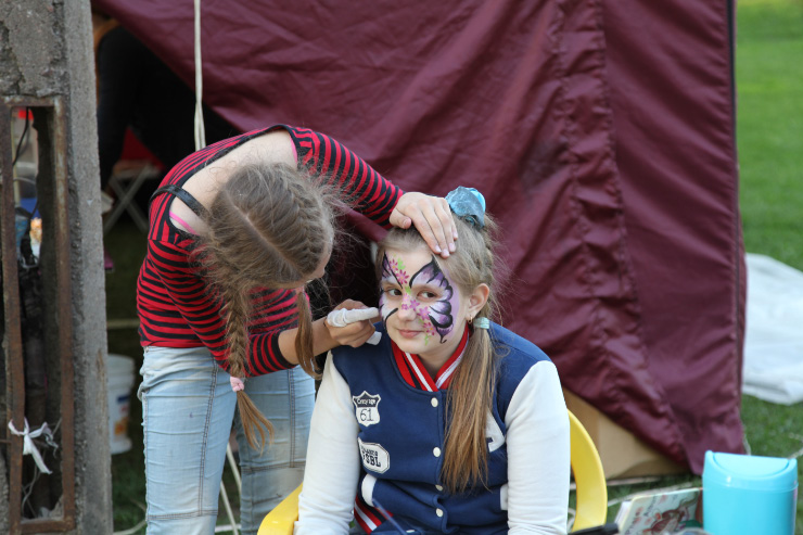 in Pskov in May girl paint butterfly on girl